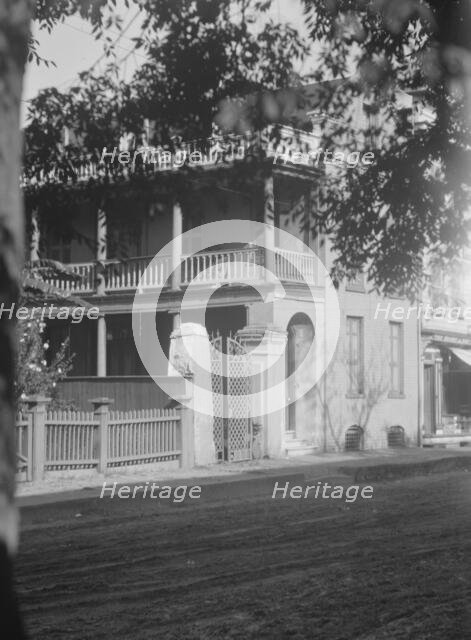 View from across street of a multi-story house, [25 Franklin Street], Charleston..., c1920-1926. Creator: Arnold Genthe.