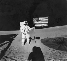 Alan Shepard (1923-1998) planting an American flag during the Apollo 14 mission, 1971. Artist: Unknown