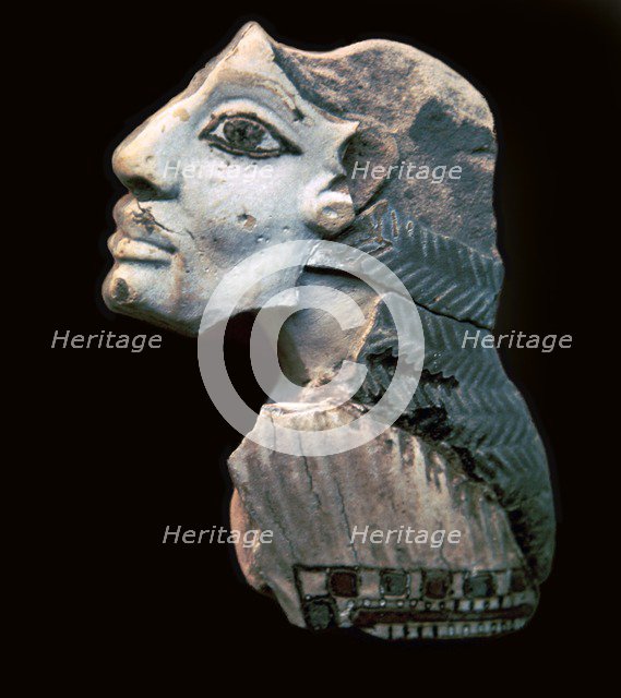 Egyptian glazed relief of a Lybian captive. Artist: Unknown