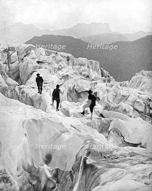 Climbing through the Bossons icefall on the way up Mont Blanc, Switzerland, early 20th century. Artist: Unknown