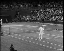 Two Male Civilians Playing a Match of Tennis at Centre Court at the All England Lawn Tennis..., 1920 Creator: British Pathe Ltd.