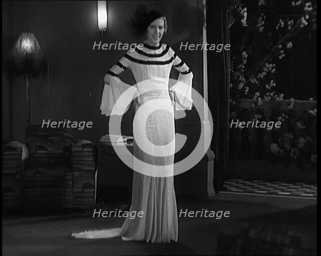 Female Civilian Modelling the Latest Fashions in a Fashion Show, 1931. Creator: British Pathe Ltd.