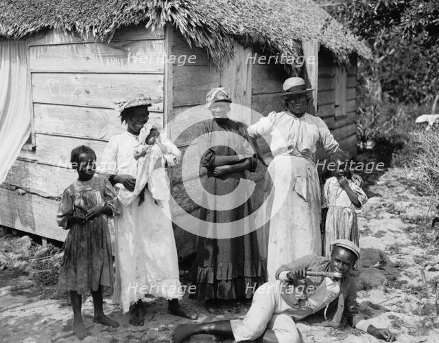 Negro family, Grant's Town, Nassau, W.I., between 1900 and 1906. Creator: William H. Jackson.