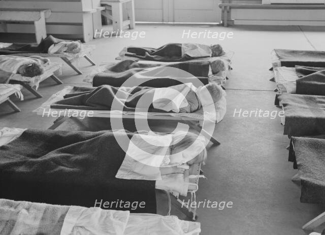 Rest time in nursery school for migrant children at Shafter Camp, California, 1939. Creator: Dorothea Lange.