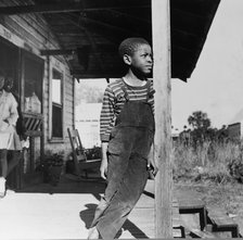 Young boy on his front porch, Daytona Beach, Florida, 1943. Creator: Gordon Parks.