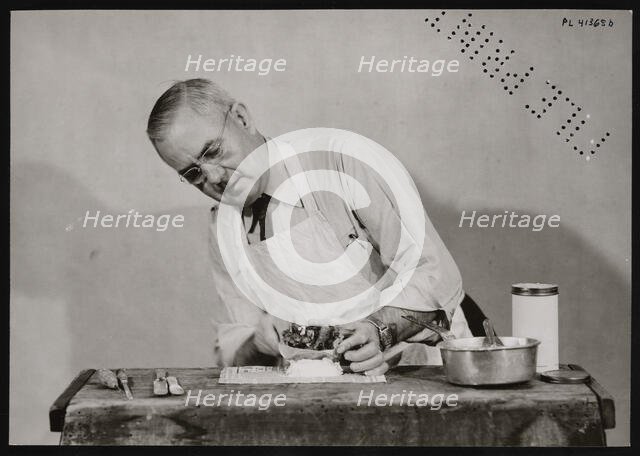 Frank Earl Holden Demonstrates Cutting into Mineral, January 18, 1951. Creator: United States National Museum Photographic Laboratory.