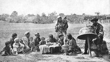Gypsies mending a family cauldron, Hungary, 1922.Artist: AW Cutler