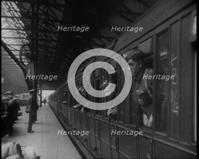 Male Members of the British Expeditionary Force Leaning Out of the Carriages as a Train is..., 1939. Creator: British Pathe Ltd.