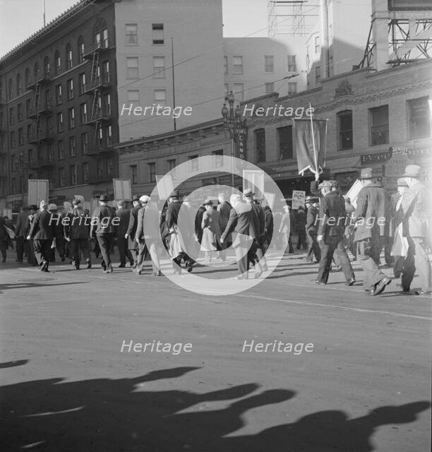 Mass meeting of WPA workers parading up Market Street, San Francisco, California , 1939. Creator: Dorothea Lange.