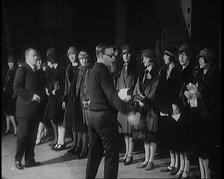 The Producer Julian Wylie Inspecting Young Prospective Female Stage Performers Standing..., 1920s. Creator: British Pathe Ltd.