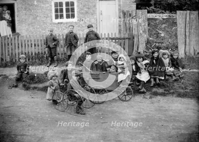 Children with go-carts at Greatworth, Northamptonshire, 1901. Artist: Alfred Newton & Sons