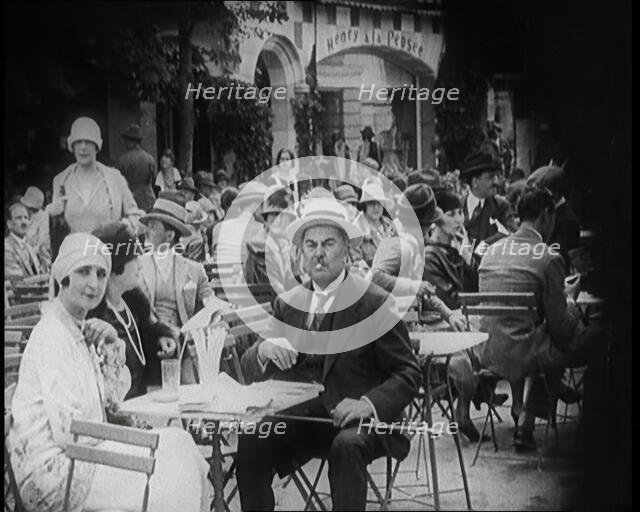 Crowds of People Enjoying Themselves at an Outside Café, 1926. Creator: British Pathe Ltd.
