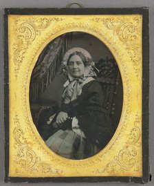 Portrait of a woman in bonnet, seated, about 1850. Creator: Unknown.