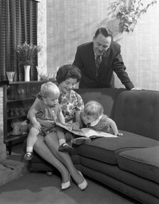 Family group looking at a brochure, Doncaster, South Yorkshire, 1963. Artist: Michael Walters