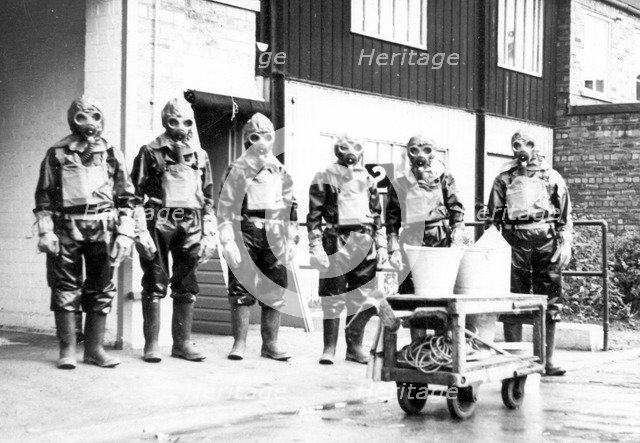 The Duncan’s factory decontamination unit dressed in their suits, Edinburgh, Scotland,1941. Artist: Unknown