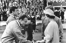 Thumbnail image of Queen Elizabeth II shaking hands with England footballer George Cohen, World Cup, Wembley, 1966. Artist: Unknown