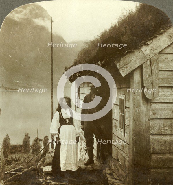 'Young farmers of the Nordfjord country - before their cottage home, Norway', c1905. Creator: Unknown.