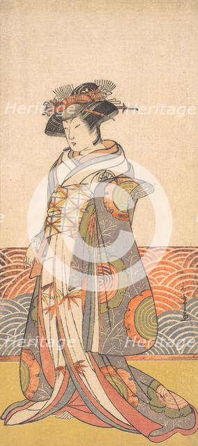 The Third Segawa Kikunojo as a Woman Standing in a Room Having a Wave-pattern Dado, ca. 1779. Creator: Shunsho.