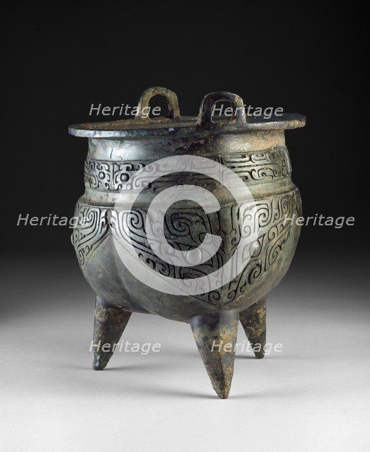 Ritual food vessel, or li ding, with taotie masks, Shang Dynasty, Erligang Period (c1500-c1300 BC). Artist: Unknown.