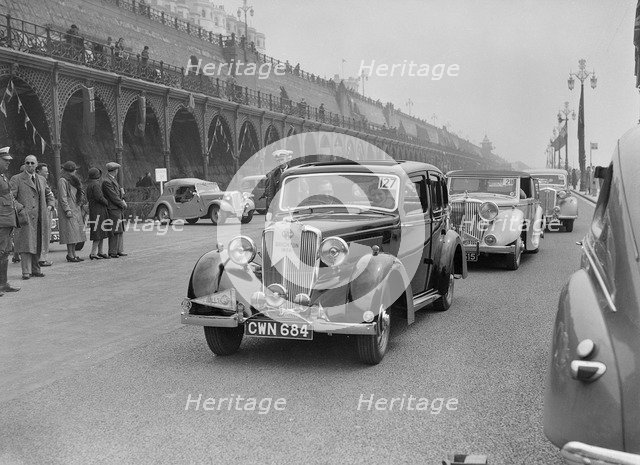 Riley 4-door saloon of AS Bassett at the RAC Rally, Madeira Drive, Brighton, 1939. Artist: Bill Brunell.