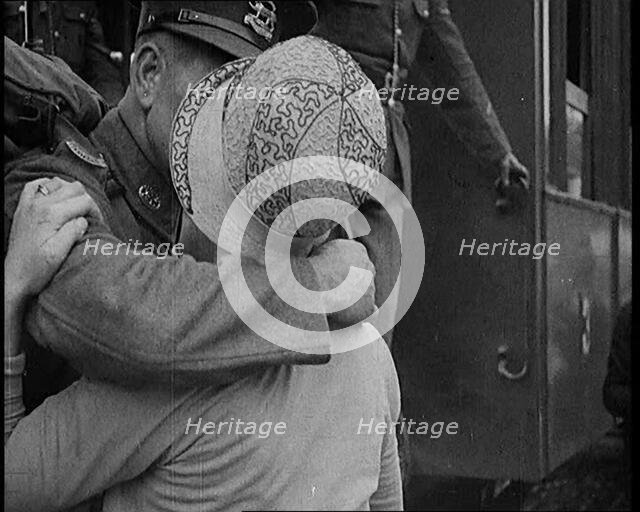 Male Soldier Kissing Female Civilian before boarding a Train, 1929. Creator: British Pathe Ltd.