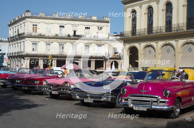 Selection of beautifully restored old American cars, alongside the Parque Central, Havana, Cuba,2024 Creator: Ethel Davies.