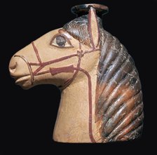 Terracotta scent bottle in the shape of a horse's head. Artist: Unknown