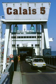 Cars boarding ferry at Calais. Artist: Unknown.
