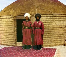 Two men standing on a rug, in front of yurt, between 1905 and 1915. Creator: Sergey Mikhaylovich Prokudin-Gorsky.