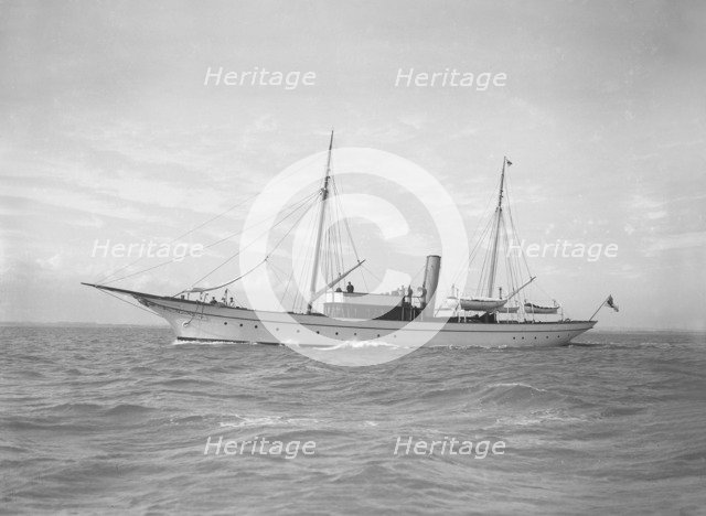 The steam yacht 'Christine' under way, 1911. Creator: Kirk & Sons of Cowes.