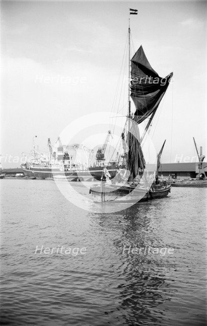 A Thames sailing barge in the Royal Albert Dock, Canning Town, London, c1945-c1965. Artist: SW Rawlings