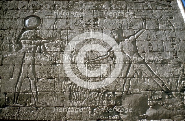 Rameses III smiting his enemies before Amun-Ra, Mortuary Temple, Medinat Habu, Egypt, c12th cen BC. Artist: Unknown
