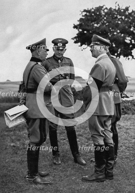 Adolf Hitler with senior German army officers, Munster training area, Germany, 1935. Artist: Unknown