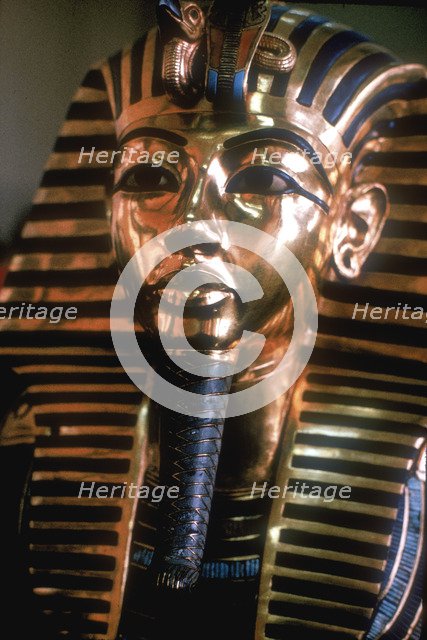 Gold mask of Tutankhamun on his mummy-case. Artist: Unknown