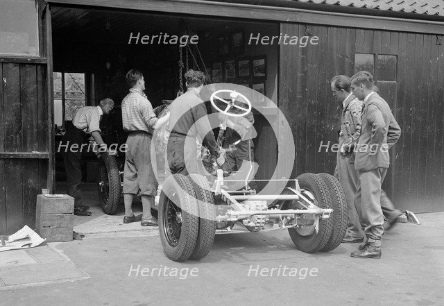 Working on Raymond Mays' Vauxhall-Villiers, c1930s. Artist: Bill Brunell.
