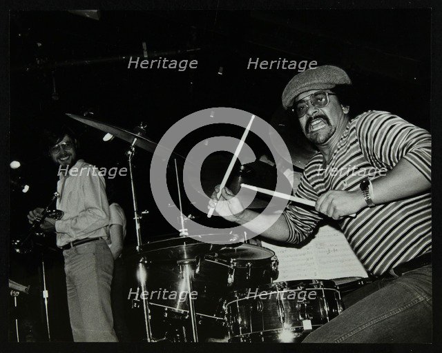 Brian Abrahams (drums) and Guy Barker (trumpet) on stage at The Stables, Wavendon, Buckinghamshire. Artist: Denis Williams