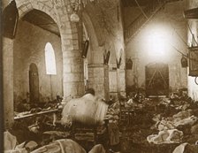 Makeshift hospital in a church, Marne, northern France, 1914. Artist: Unknown.