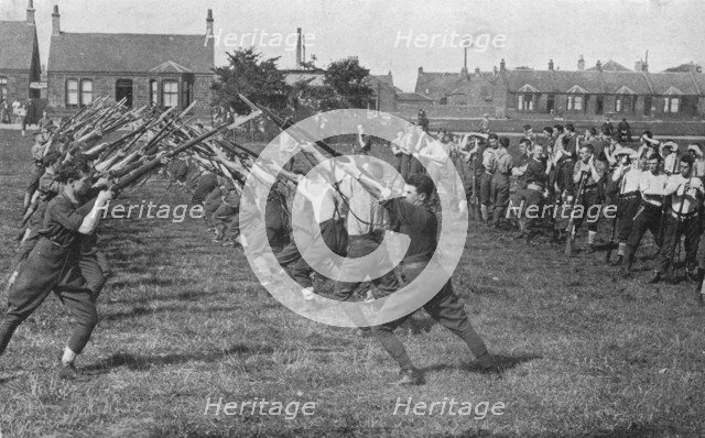 'Recruits learning the use of the bayonet', 1915. Artist: Unknown.