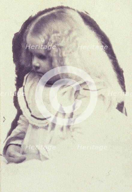 Young fair haired girl seated with hands in her lap, c1900. Creator: Estelle Huntington Huggins.
