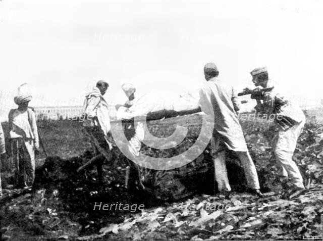 Scenes in Plague-Stricken Bombay: burying a poor man...[without funds for] cremation...., 1898. Creator: Gysi.