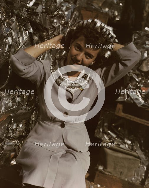 Annette del Sur publicizing salvage campaign...Douglas Aircraft Company, Long Beach, Calif., 1942. Creator: Alfred T Palmer.