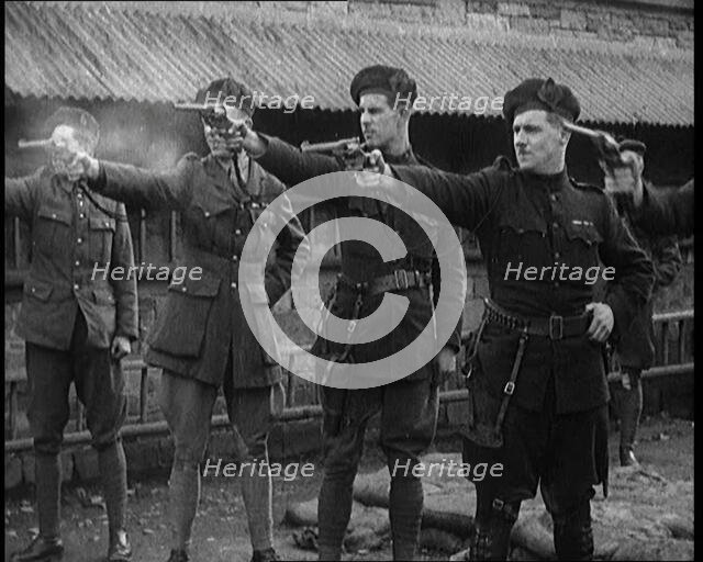 British Officers Firing Revolvers at Targets, 1921. Creator: British Pathe Ltd.
