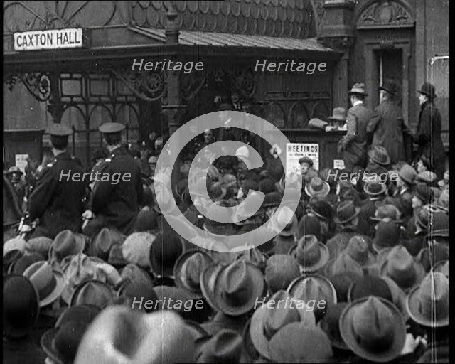 A Large Group of Civilians and Two Uniformed Males on Horse Back Outside Caxton Hall, 1924. Creator: British Pathe Ltd.