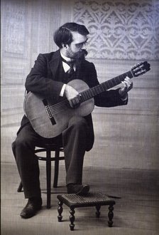 Francisco Tárrega Eixea (1852-1909), guitarist and composer, portrait playing guitar.