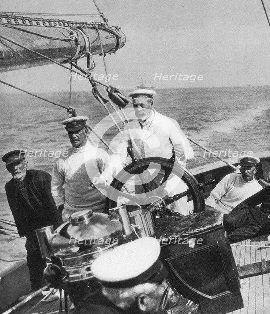 King George V at the helm of his yacht Britannia, c1930s. Artist: Unknown
