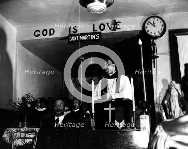 Reverend Vondell Gassaway, pastor of the St. Martin's Spiritual Church..., Washington, D.C., 1942. Creator: Gordon Parks.