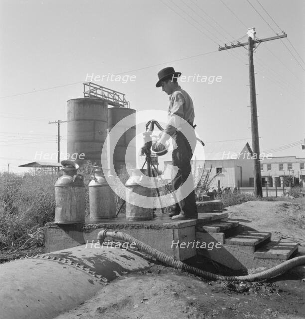 Drinking water for the whole town..., Tulelake, Siskiyou County, California, 1939. Creator: Dorothea Lange.