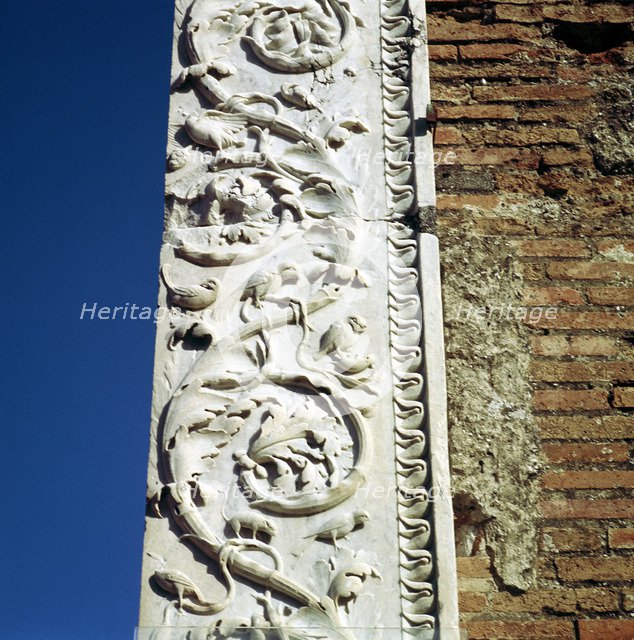 Decoration on the jamb of the dooway of the Building of Eumachia in the Forum, Pompeii, Italy. Creator: Unknown.
