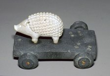Persian hedgehog mounted on a wheeled carriage. Artist: Unknown