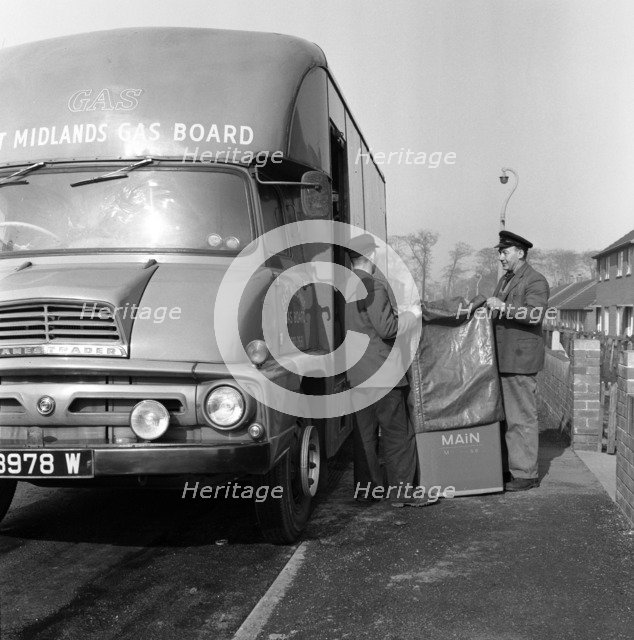 Home delivery of a cooker, Darfield, Barnsley, South Yorkshire, 1963. Artist: Michael Walters